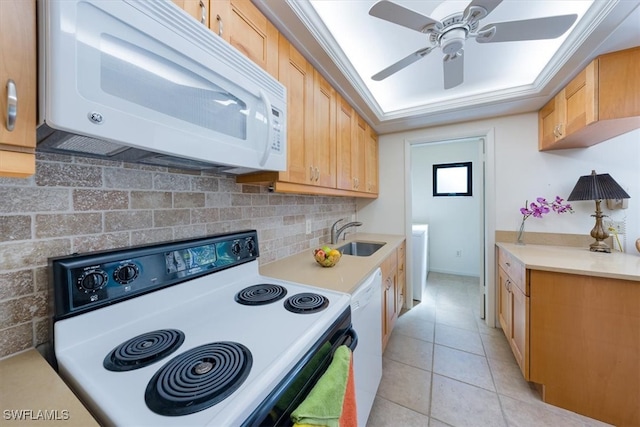 kitchen featuring sink, tasteful backsplash, light tile patterned floors, white appliances, and ceiling fan