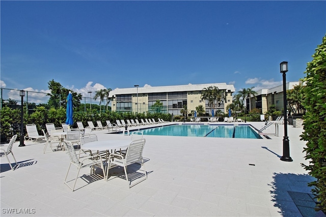 view of pool featuring a patio