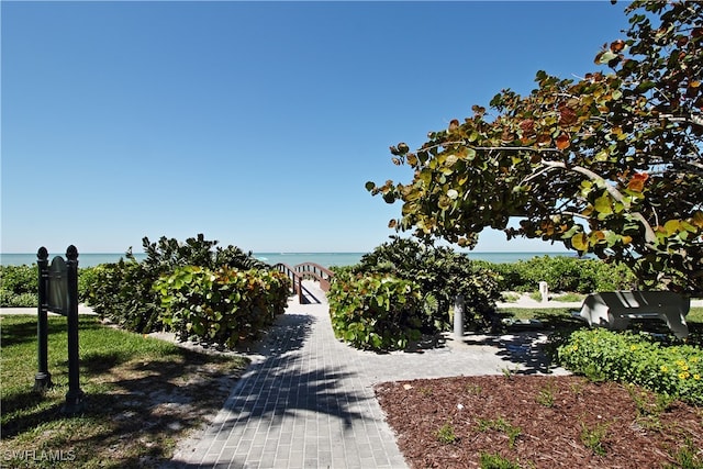 view of home's community with a water view