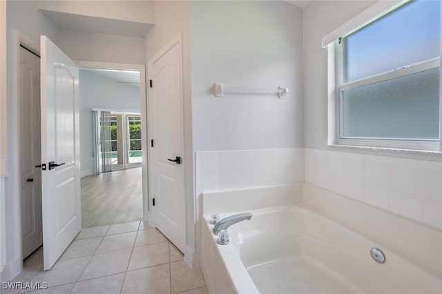 bathroom featuring a tub to relax in and hardwood / wood-style floors