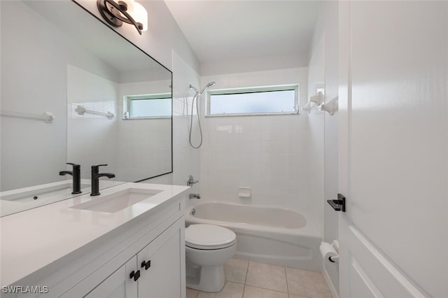 full bathroom featuring vanity, tile patterned flooring, tiled shower / bath combo, and toilet