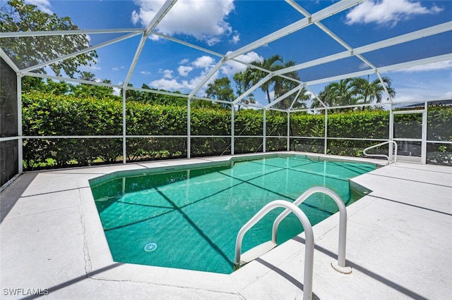 view of pool featuring a patio area and a lanai