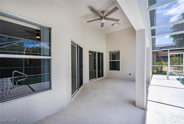 view of patio with a lanai and ceiling fan