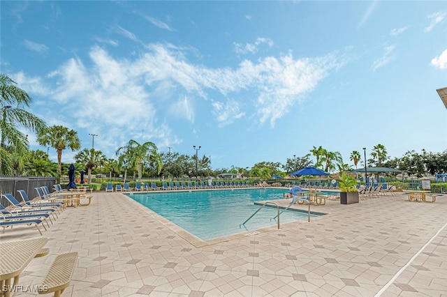 view of swimming pool featuring a patio area