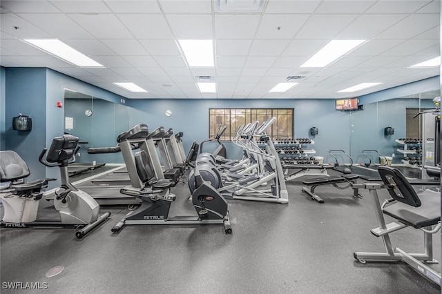 gym featuring a paneled ceiling