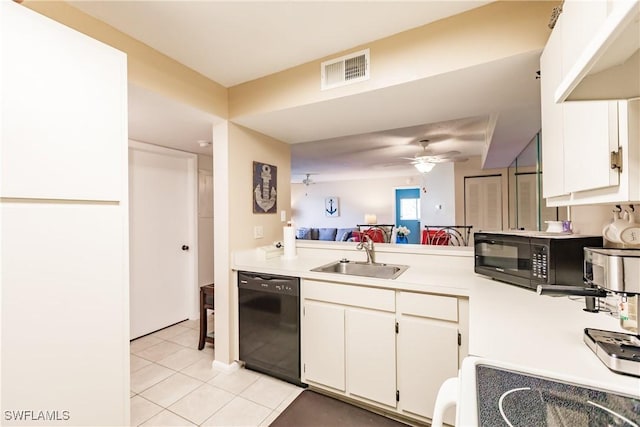 kitchen featuring a sink, black appliances, light tile patterned floors, ceiling fan, and light countertops