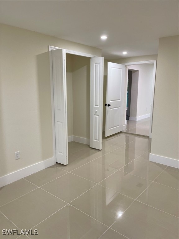 unfurnished bedroom featuring light tile patterned floors