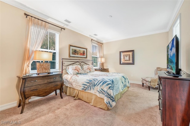 bedroom with ornamental molding, carpet flooring, and baseboards