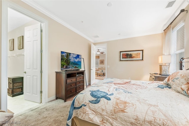 bedroom with carpet floors, ornamental molding, and baseboards