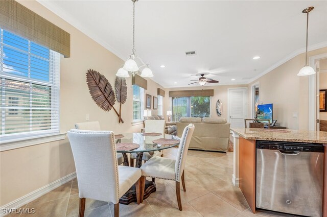 dining area featuring ceiling fan, light tile patterned floors, and ornamental molding