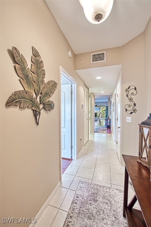 hallway with light tile patterned flooring