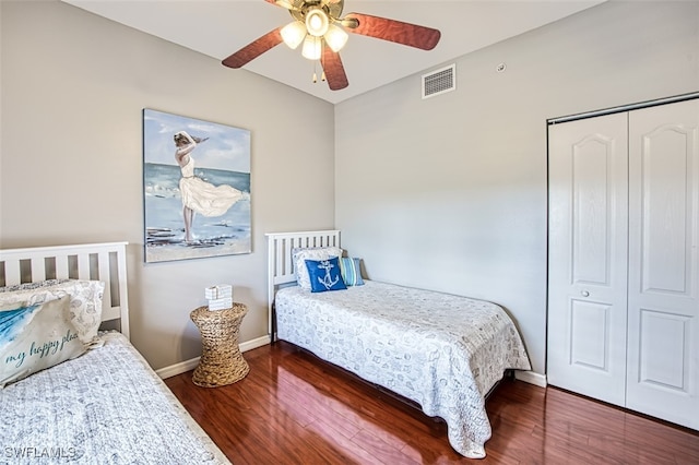 bedroom featuring hardwood / wood-style floors, a closet, and ceiling fan