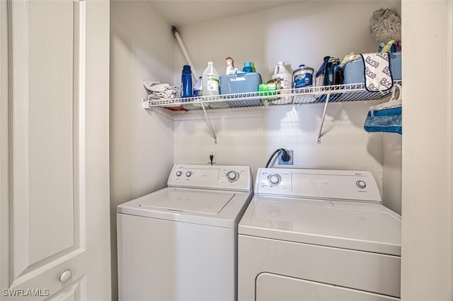 laundry room with independent washer and dryer