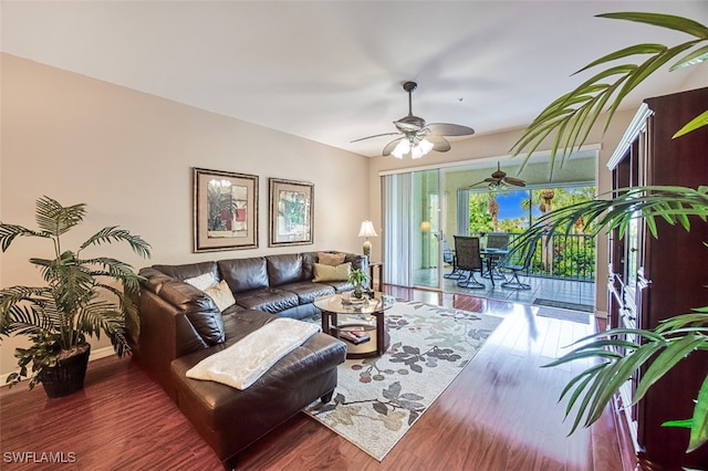 living room featuring ceiling fan and hardwood / wood-style floors