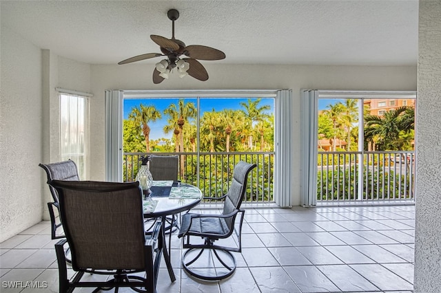 sunroom / solarium with ceiling fan