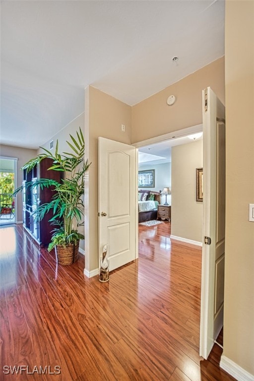 corridor featuring hardwood / wood-style floors