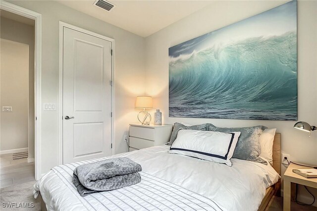 bedroom featuring hardwood / wood-style floors