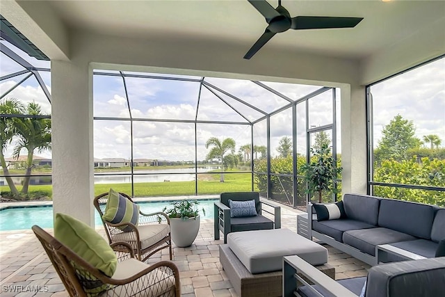 sunroom / solarium featuring ceiling fan