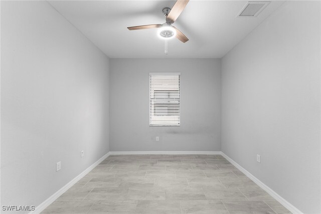 spare room with ceiling fan