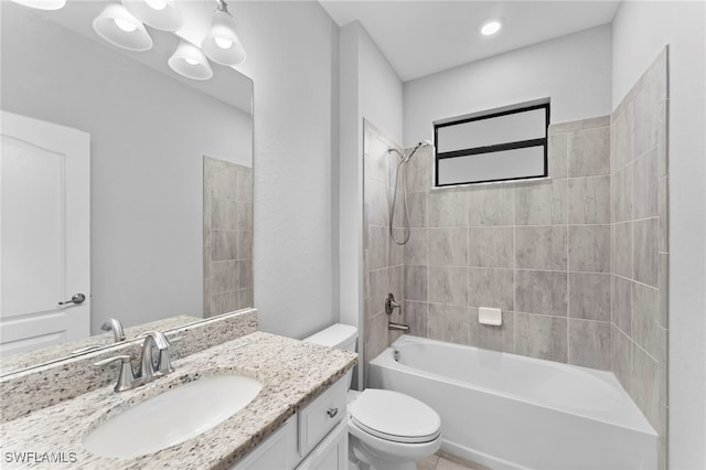 full bathroom featuring toilet, vanity, and washtub / shower combination