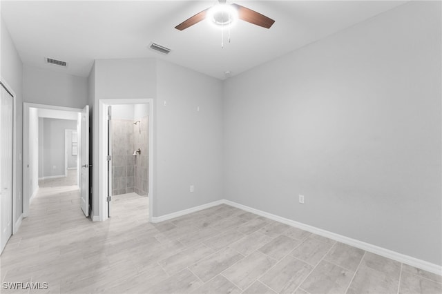 unfurnished bedroom featuring a ceiling fan, visible vents, baseboards, and ensuite bathroom