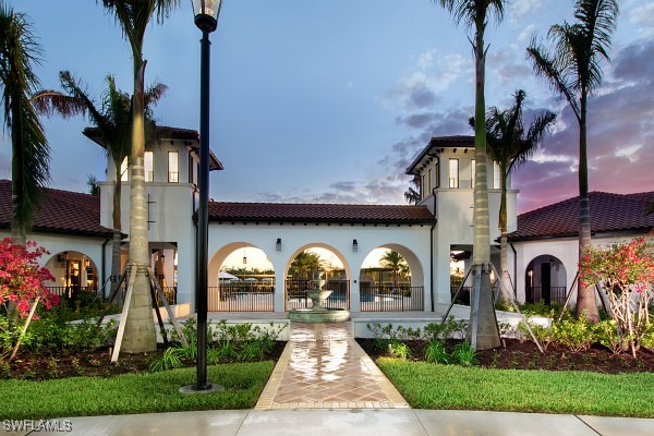 view of outdoor building at dusk