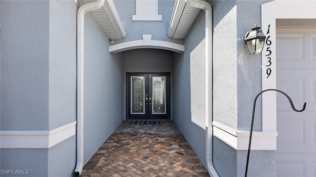 entrance to property featuring french doors