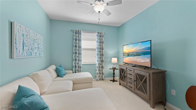 living room with ceiling fan and light colored carpet