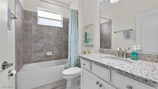 full bathroom featuring shower / bath combo, toilet, and vanity