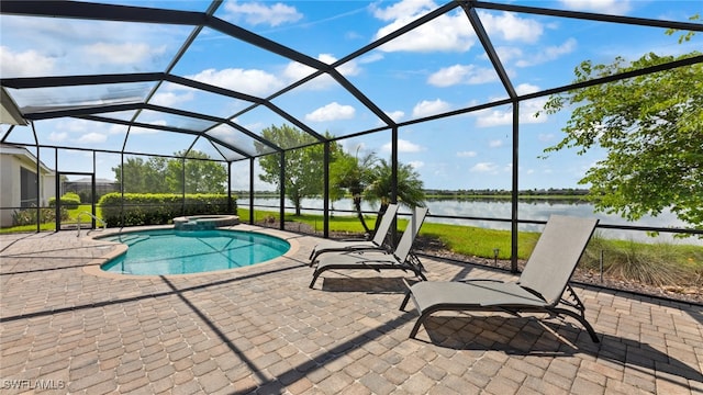 view of pool featuring a water view, a patio area, and a lanai