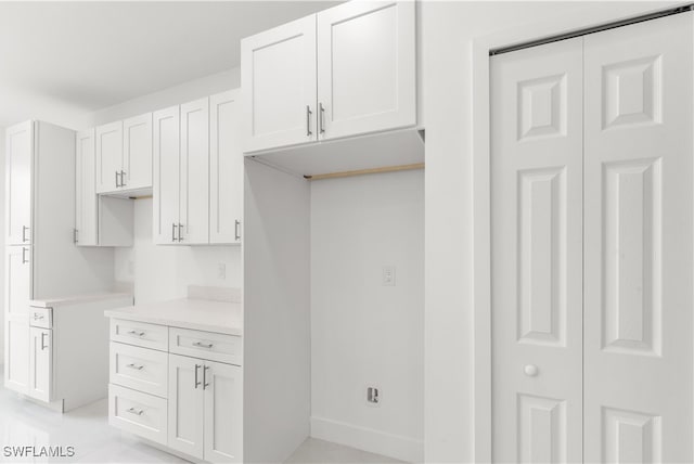 kitchen featuring white cabinets