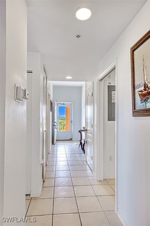 corridor with light tile patterned floors