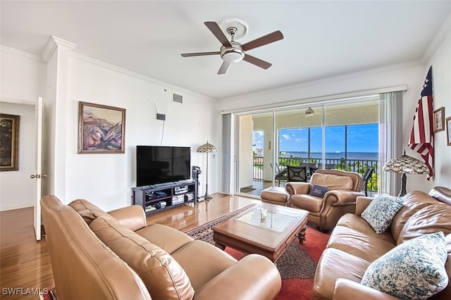 living room with ceiling fan, ornamental molding, and hardwood / wood-style floors