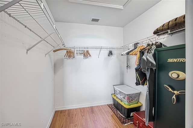 walk in closet featuring wood-type flooring