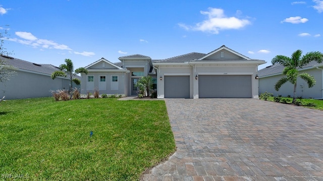 view of front of home with a garage and a front yard