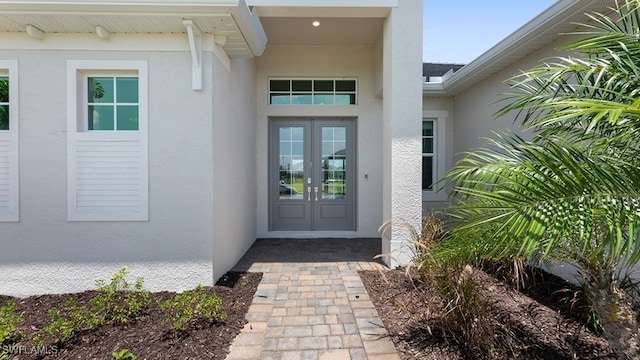 property entrance featuring french doors