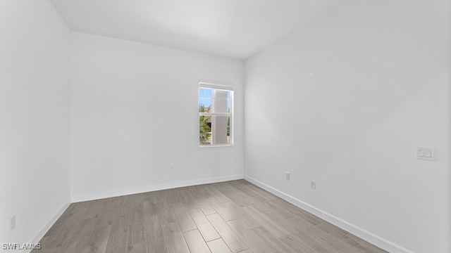 spare room with light wood-type flooring