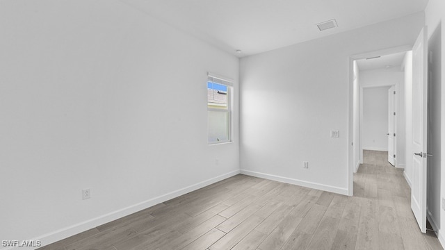 spare room with light wood-type flooring