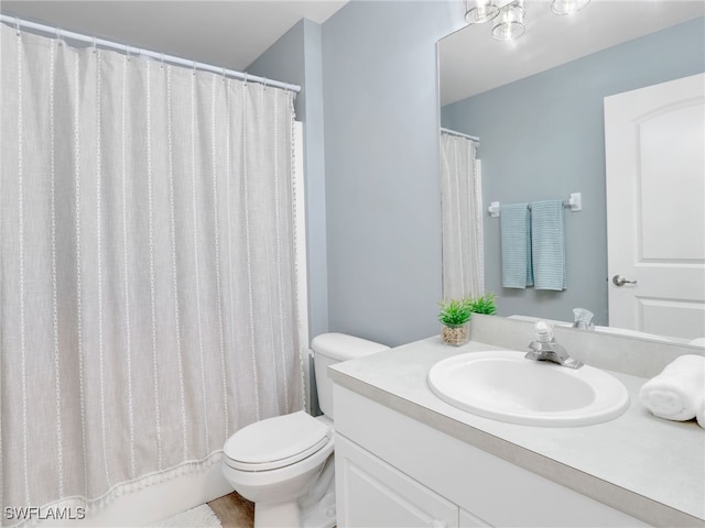 bathroom with vanity and toilet