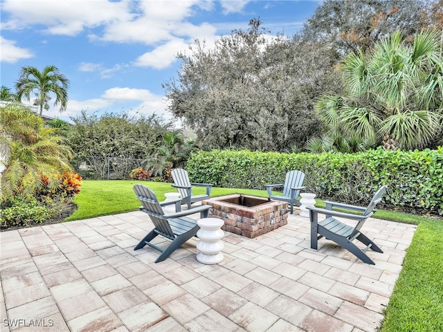 view of patio / terrace featuring an outdoor fire pit