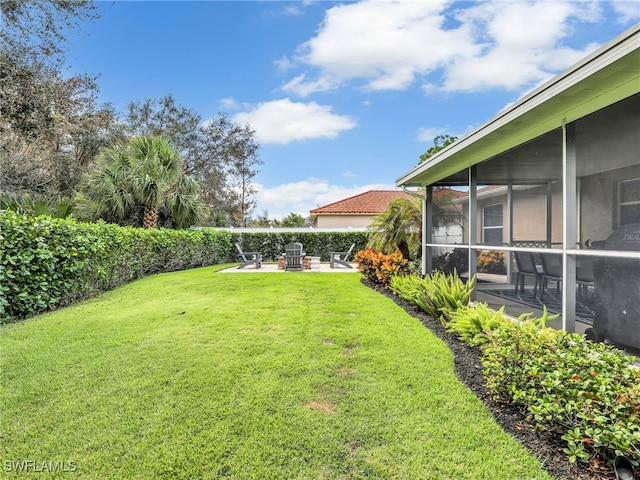 view of yard featuring a patio area and a sunroom