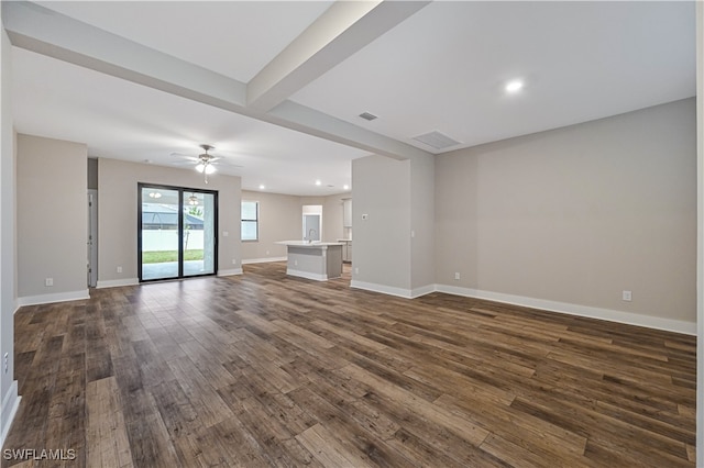 unfurnished living room with sink, wood-type flooring, and ceiling fan