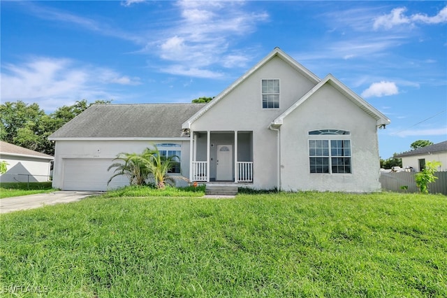 view of property featuring a front lawn and a garage