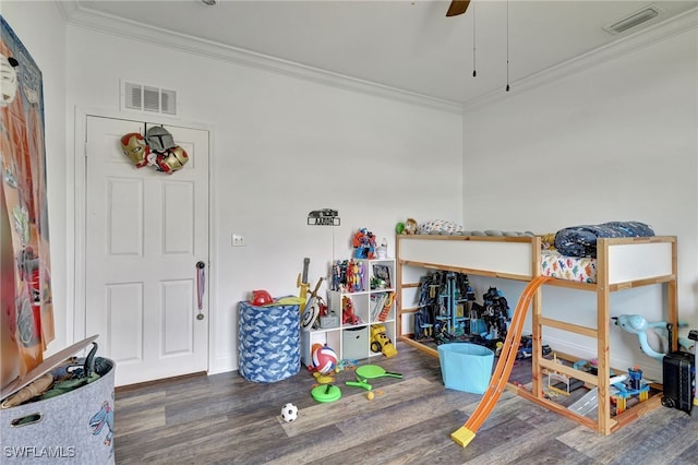 bedroom featuring ceiling fan, hardwood / wood-style flooring, and ornamental molding