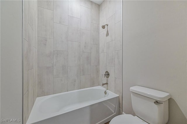 bathroom featuring toilet and tiled shower / bath combo