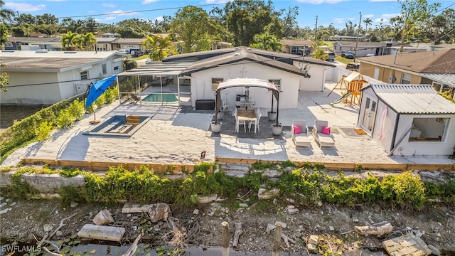 rear view of house featuring a patio