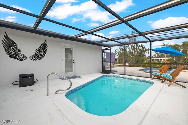 view of swimming pool with a patio and glass enclosure