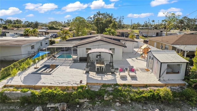 back of property with a patio area