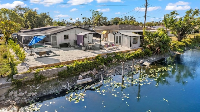 rear view of property featuring a patio area