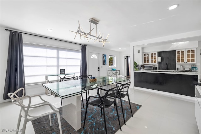 dining space featuring light tile patterned flooring